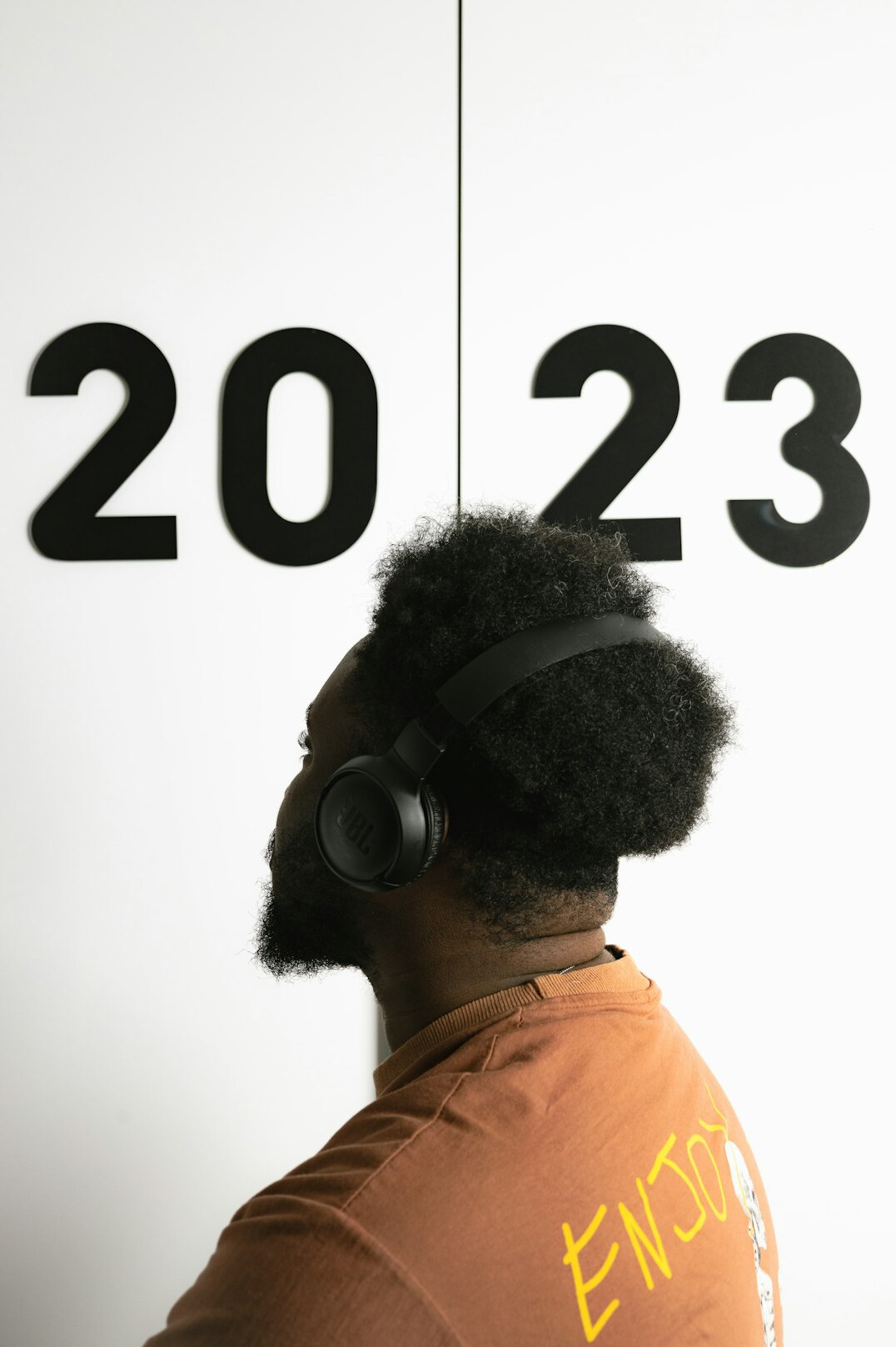 Smiling man wearing a headset in a studio